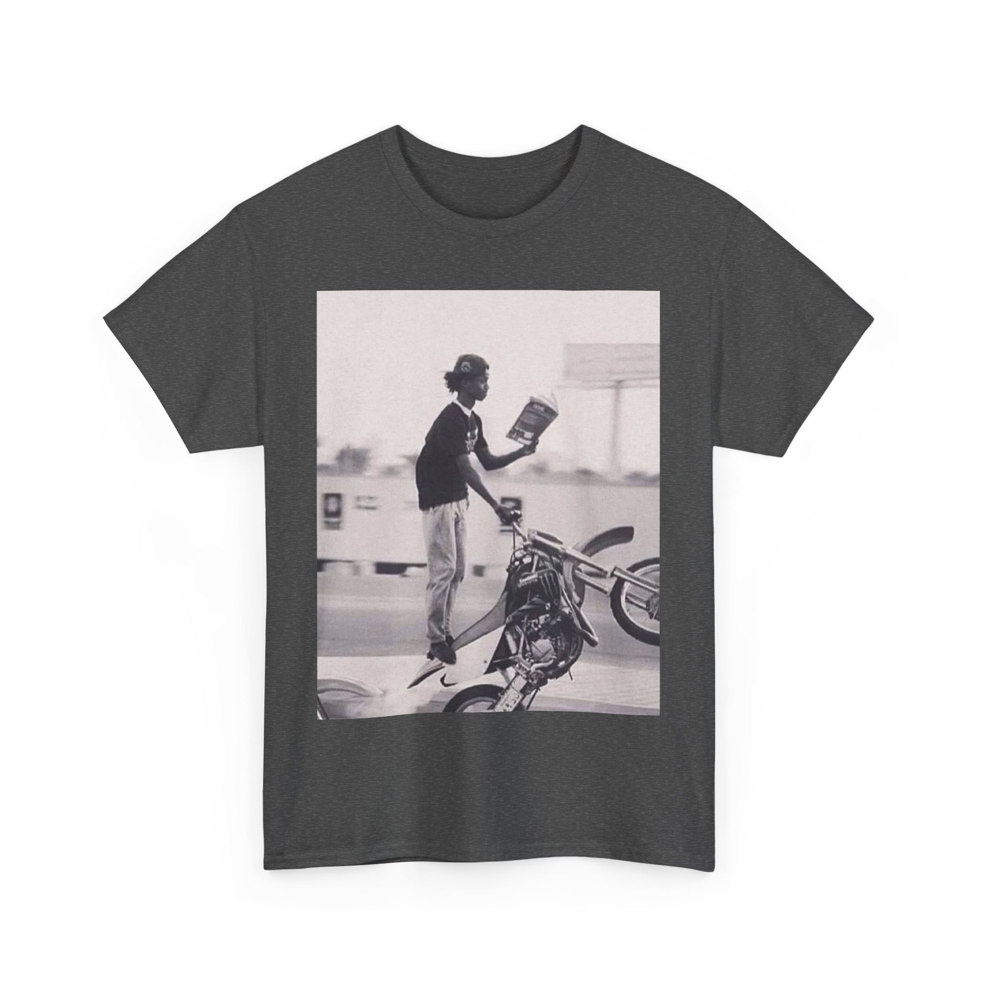 T-shirt with a graphic of a person wheeling on a motorcycle and reading a book 
