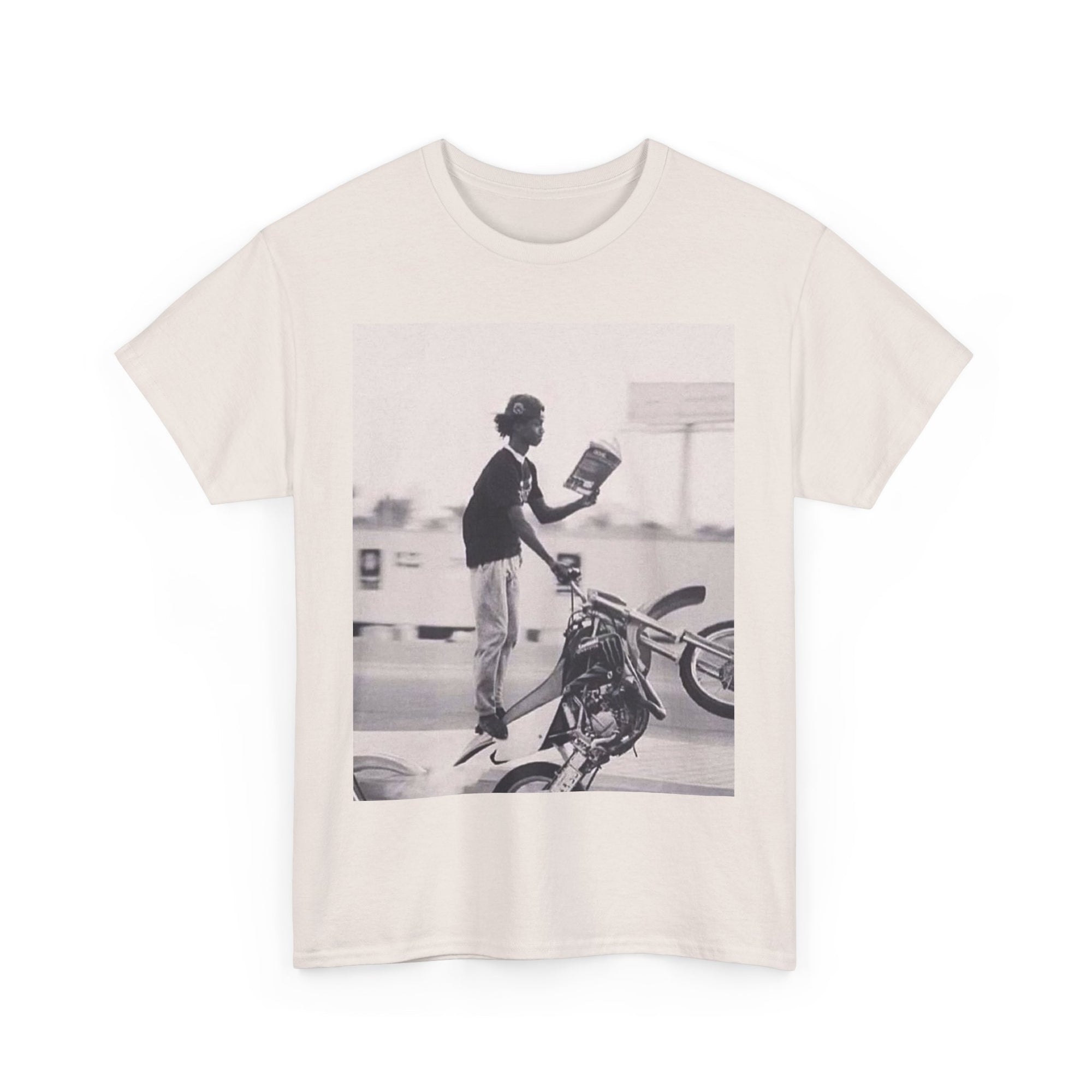 off White t-shirt with a graphic of a person on a motorcycle wheeling and reading a book 