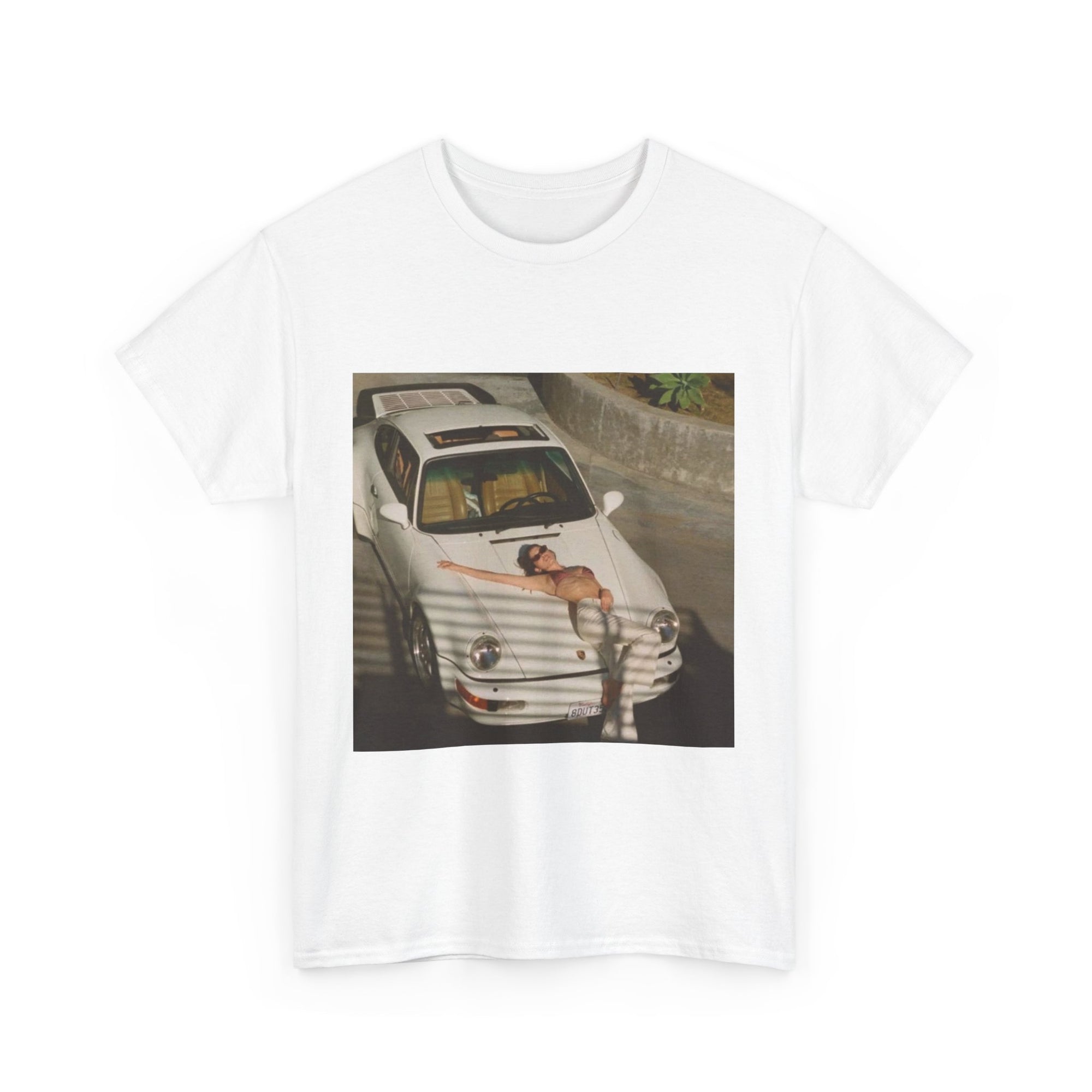 t-shirt with a graphic of a car and sexy woman on the hood 