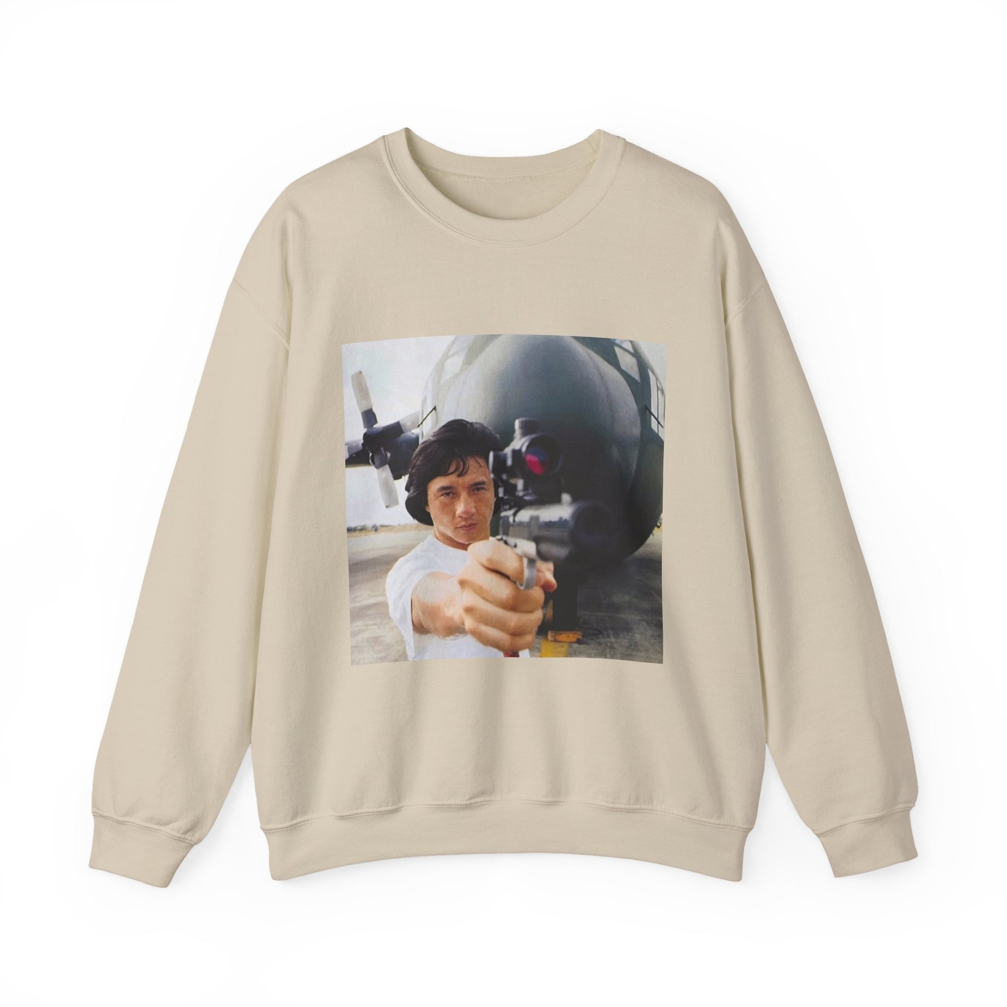 Beige sweatshirt with a graphic of a jackie chan holding a weapon infront of an airplane