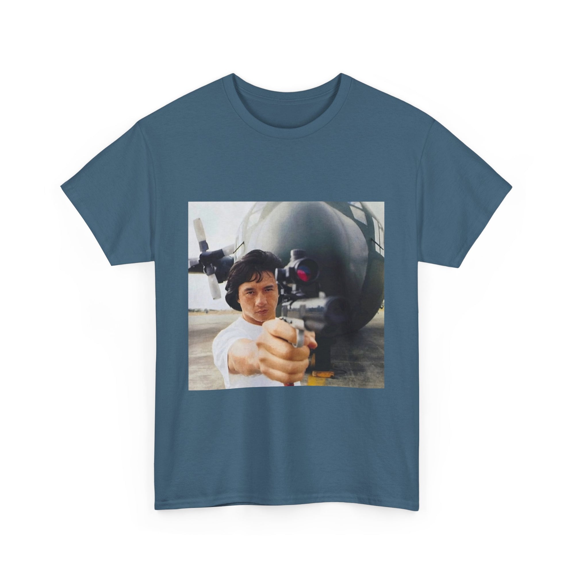 Blue t-shirt with a graphic of a person holding a gun in front of a missile on a white background