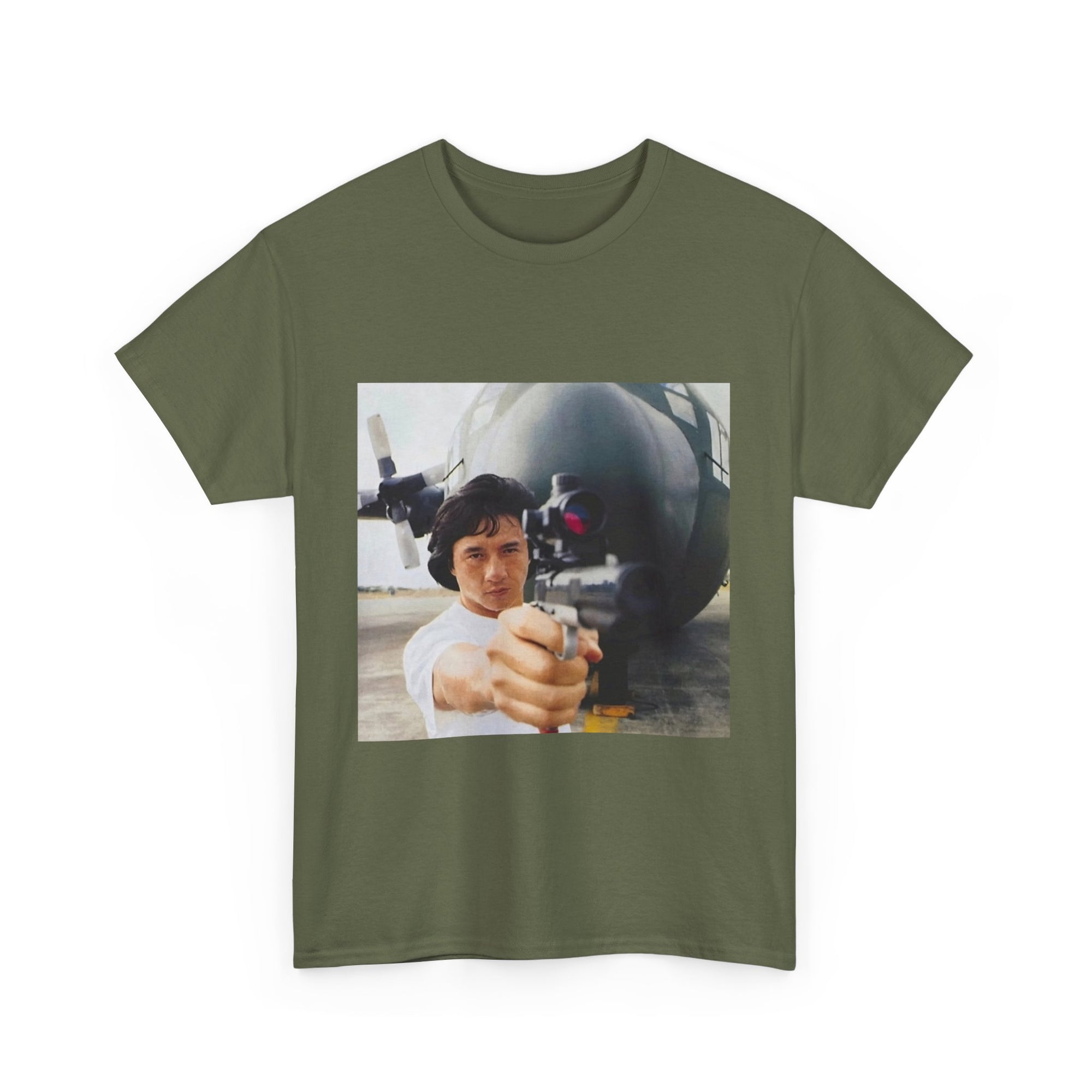 Green t-shirt with a graphic of a person holding a gun and a missile on a white background