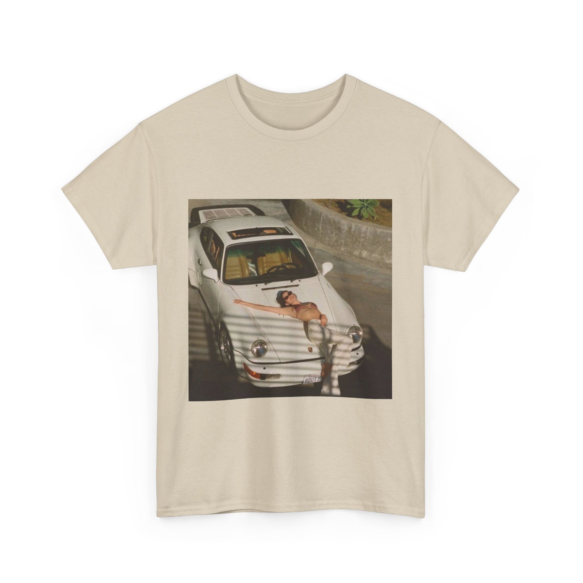 t-shirt with a graphic of a white porsche car and sexy woman on the hood 