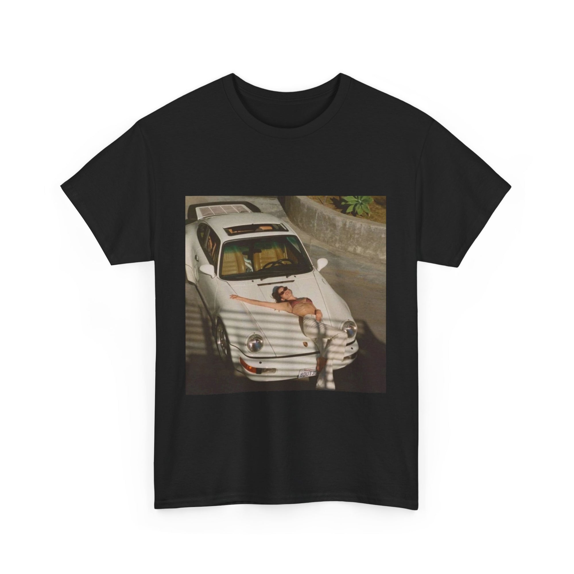 t-shirt with a graphic of a white porsche car and sexy woman on the hood 